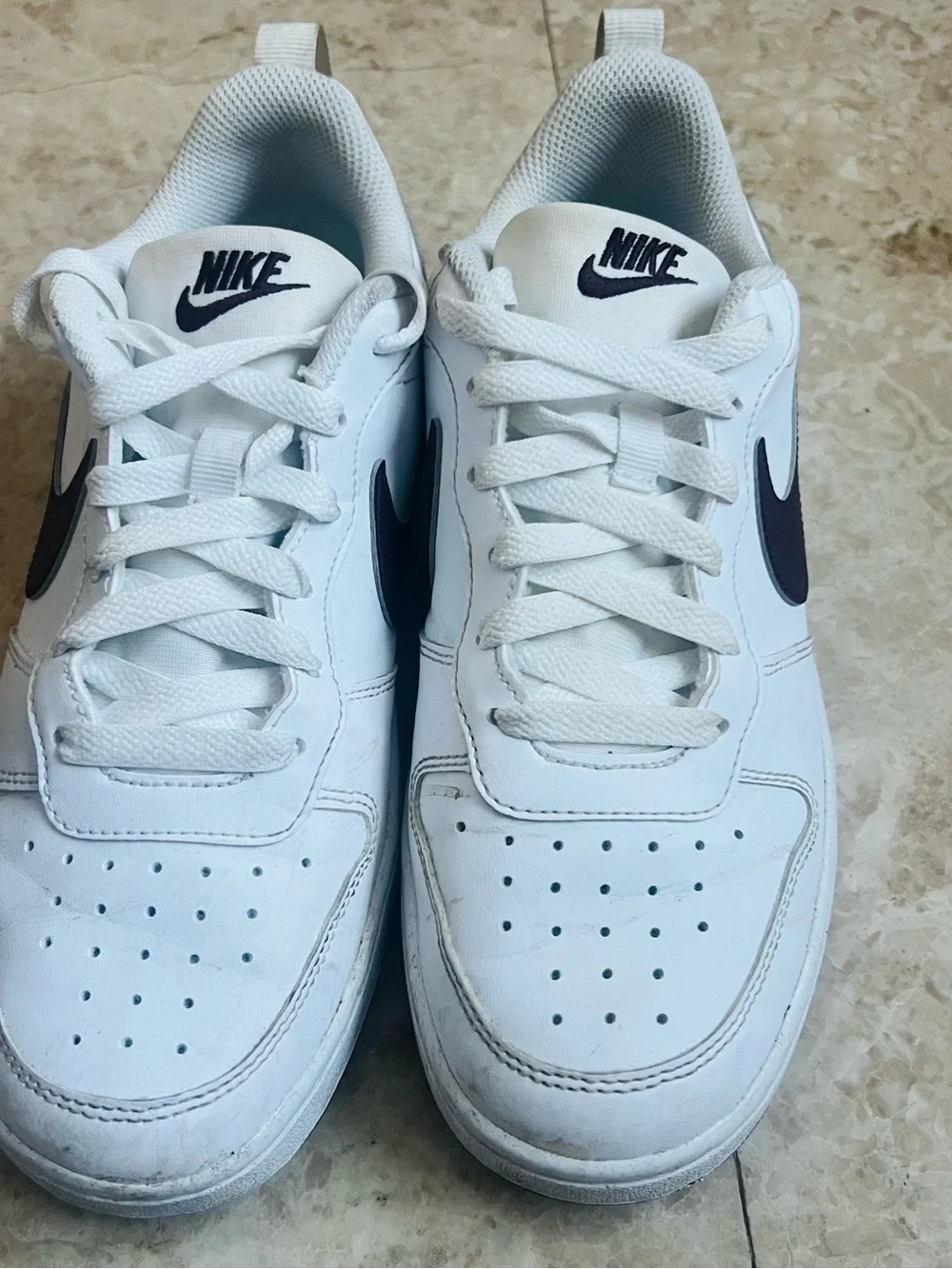 Nike White Low-Top Sneakers with Navy Swoosh